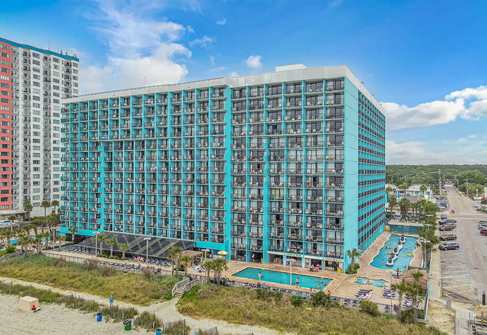 Myrtle Beach oceanfront condo building with easy access to the beach, nearby dining, and classic coastal views for a relaxing seaside getaway.
