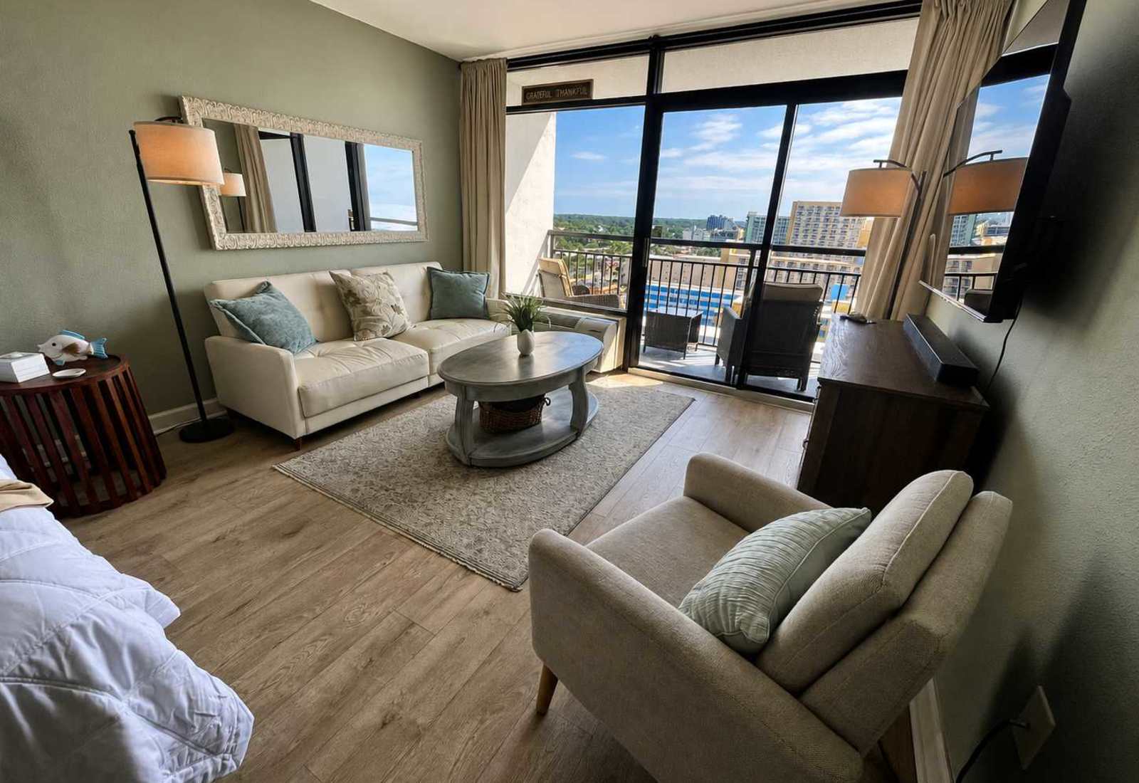 Bright coastal comfort with private balcony views.