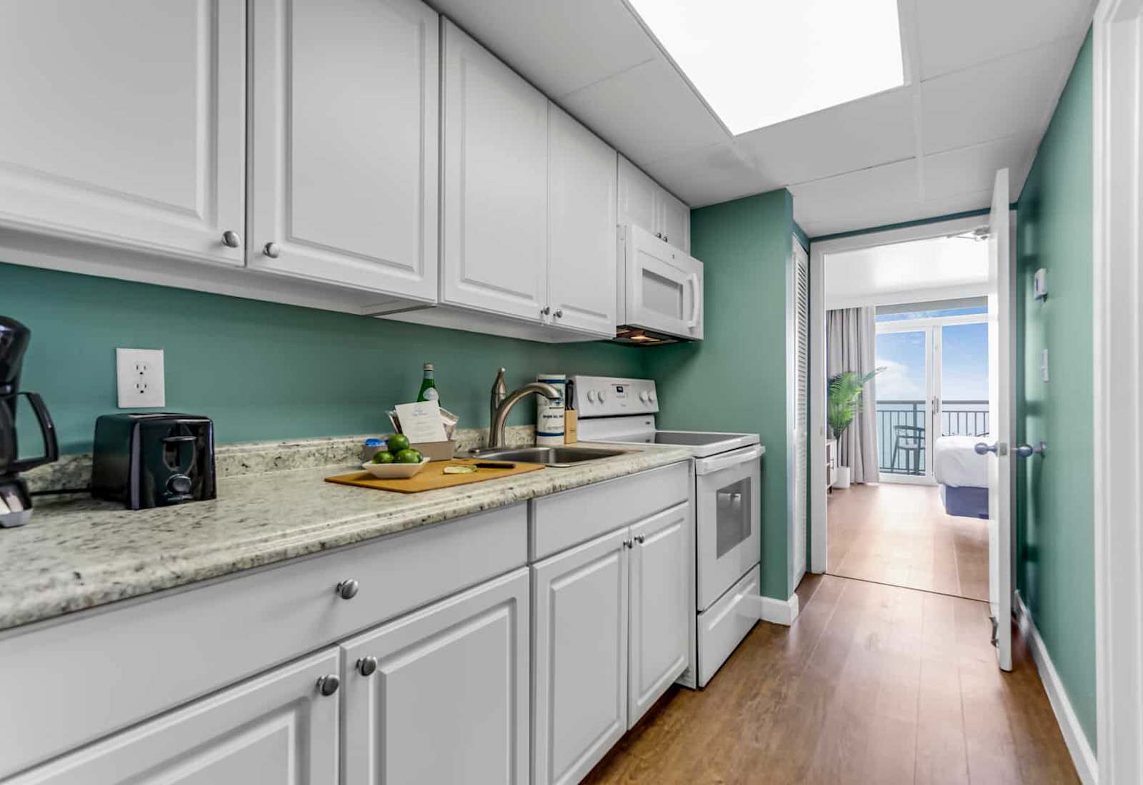 Whip up delicious meals in this fully equipped kitchen, featuring modern appliances and a sleek design. With the ocean breeze just steps away, it’s the perfect blend of convenience and coastal charm for your getaway.