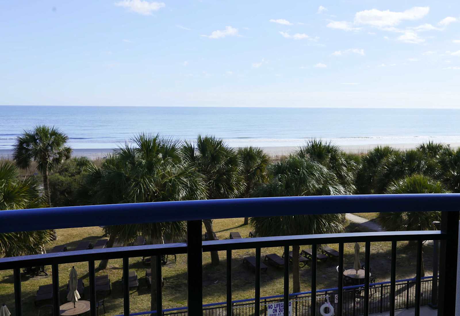 Breathe in the fresh salt air from your private balcony, where ocean breezes and swaying palms create the perfect coastal escape.