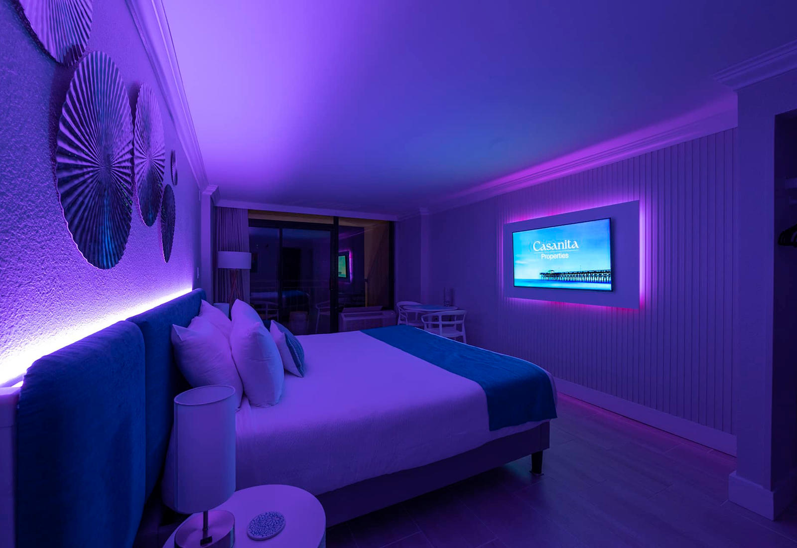 Relax in a modern and stylish room with customizable mood lighting.