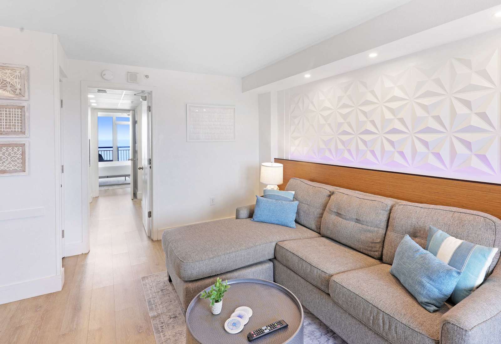 Unwind in style in our spacious living area, featuring LED mood lighting, plush seating, and a flat-screen TV for entertainment.