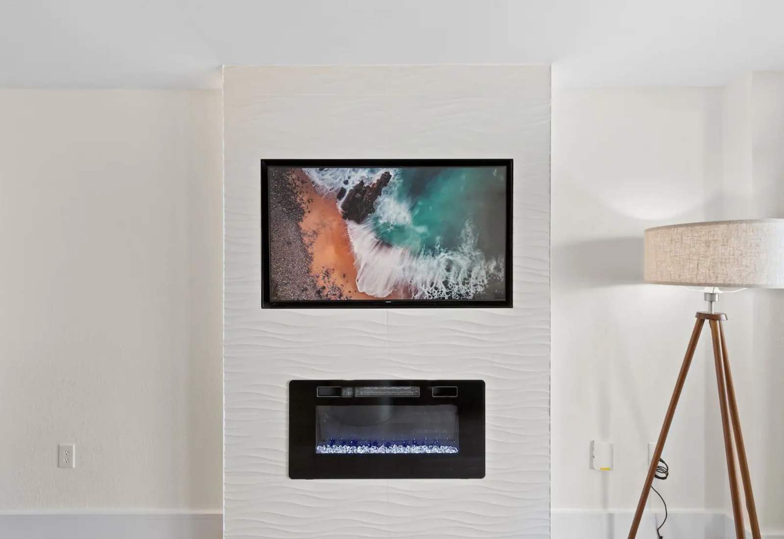 Curl up in the bed in front of the electric fireplace and stream your favorite movie on the large flat-screen Smart TV. 

