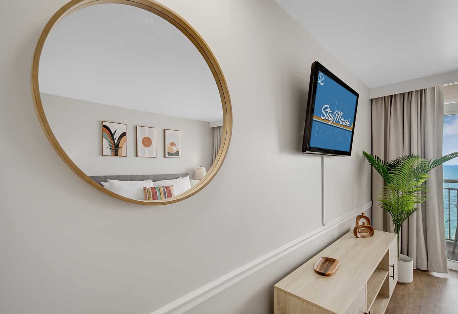 Discover modern elegance in every detail. This stylish space boasts chic wall art, a sleek entertainment setup, and a serene ocean view from the balcony. Perfect for unwinding after a day of exploring the beach!