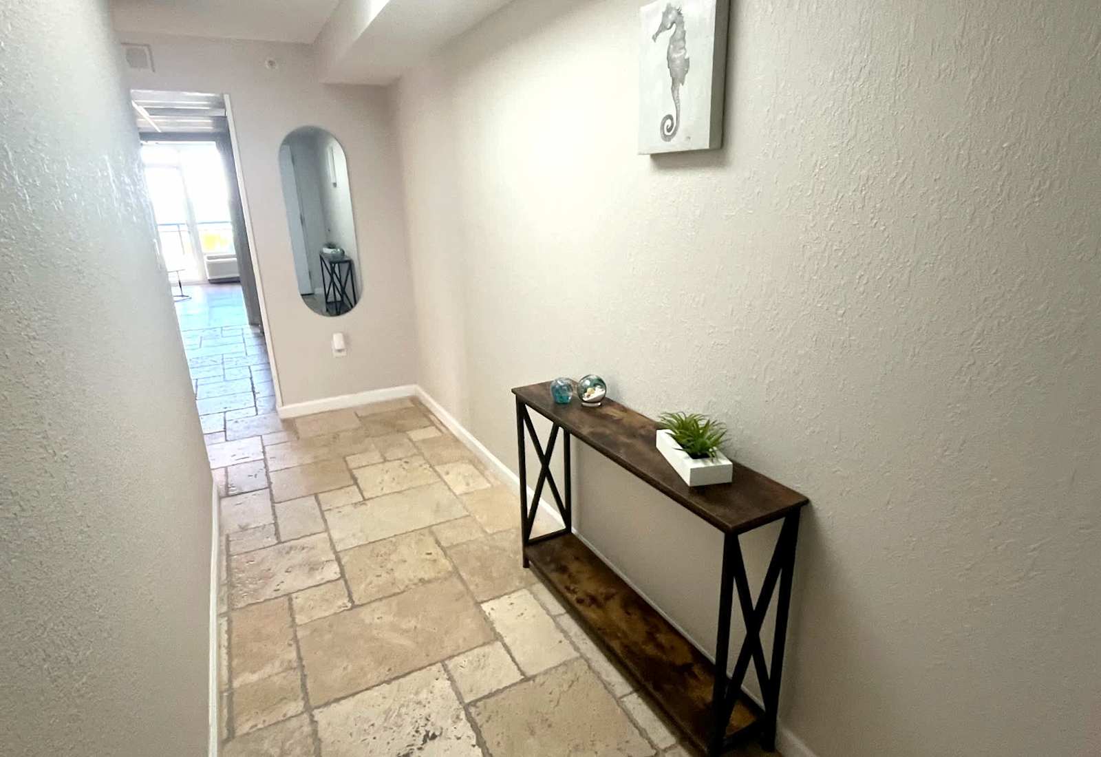 An elegant, sunlit entryway that welcomes you home after a day by the ocean.