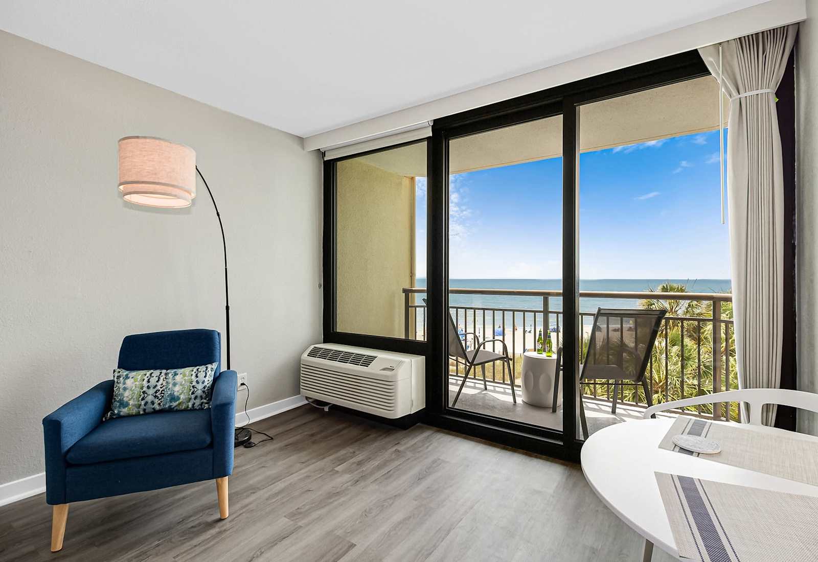 Whether you're streaming a movie or soaking up the ocean view, this bright and airy room offers comfort, entertainment, and coastal charm all in one relaxing space.