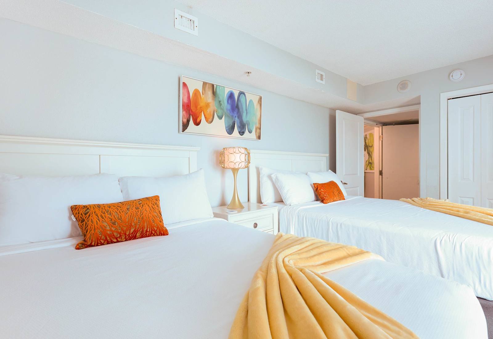 Bright, colorful, and cozy—this cheerful bedroom features two comfy beds, fresh linens, and vibrant decor. Perfect for families or friends looking to unwind and recharge during their Myrtle Beach vacation!