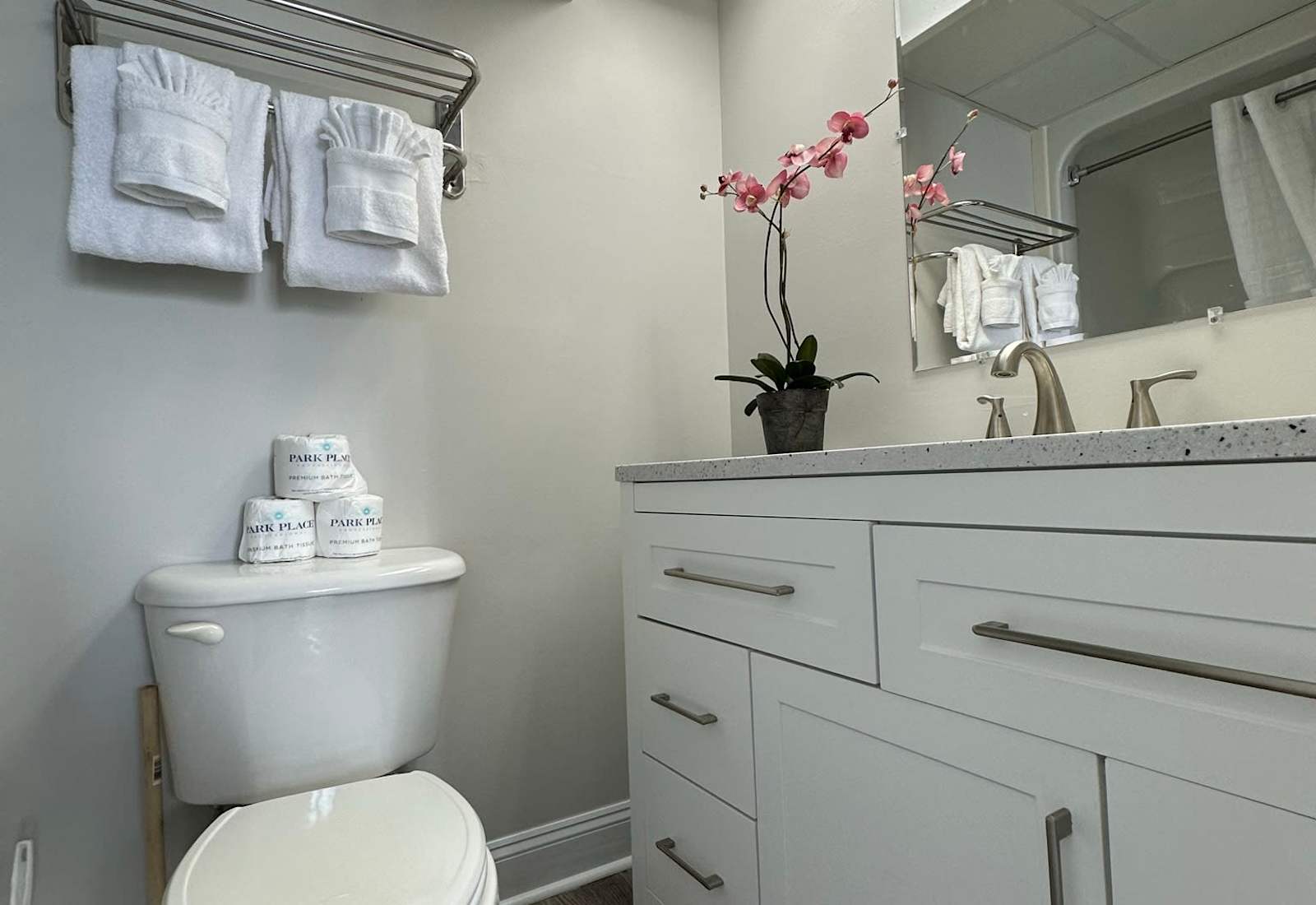 Relax and unwind in the clean and modern bathroom with a shower/tub combo and granite countertop vanity. 
