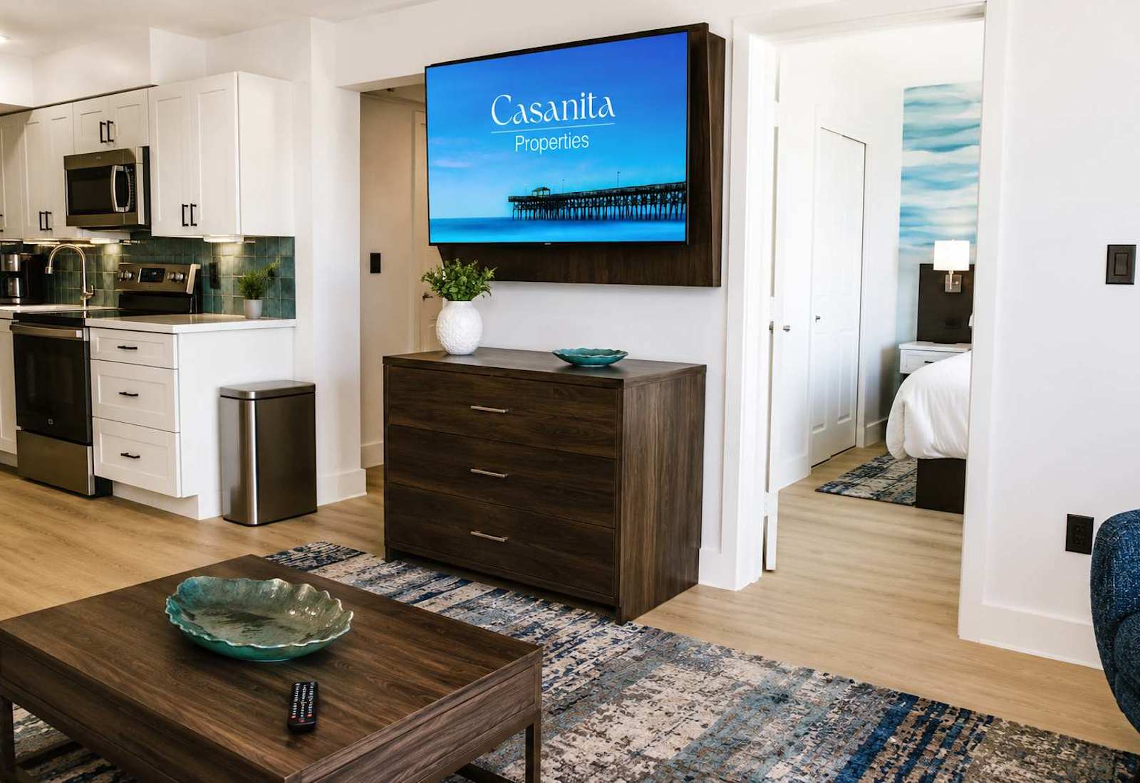Bright, modern, and fully equipped living area features a 55" Smart TV.