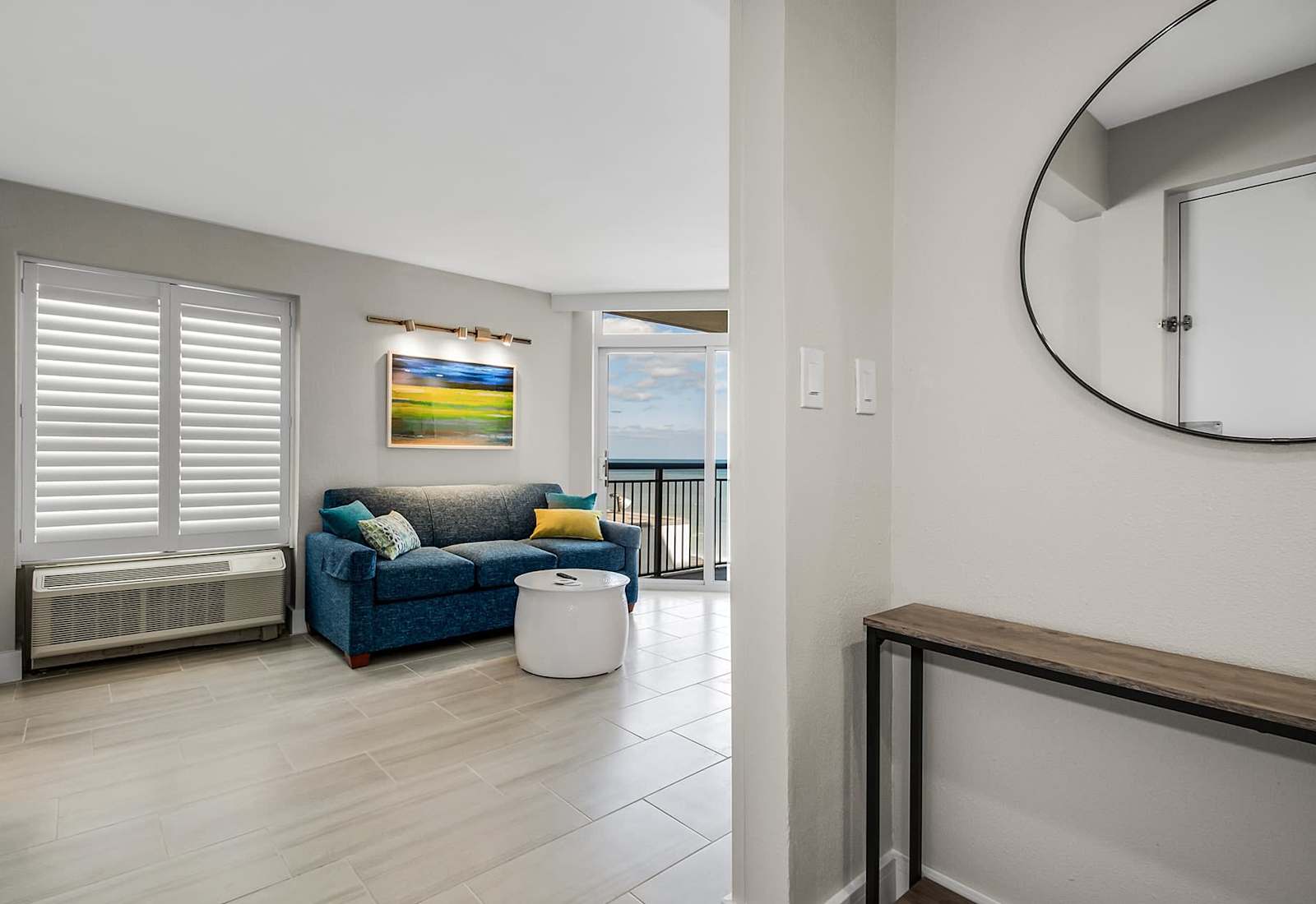 
Relax in this inviting living space featuring a plush sectional sofa, wall-mounted TV, and modern decor.