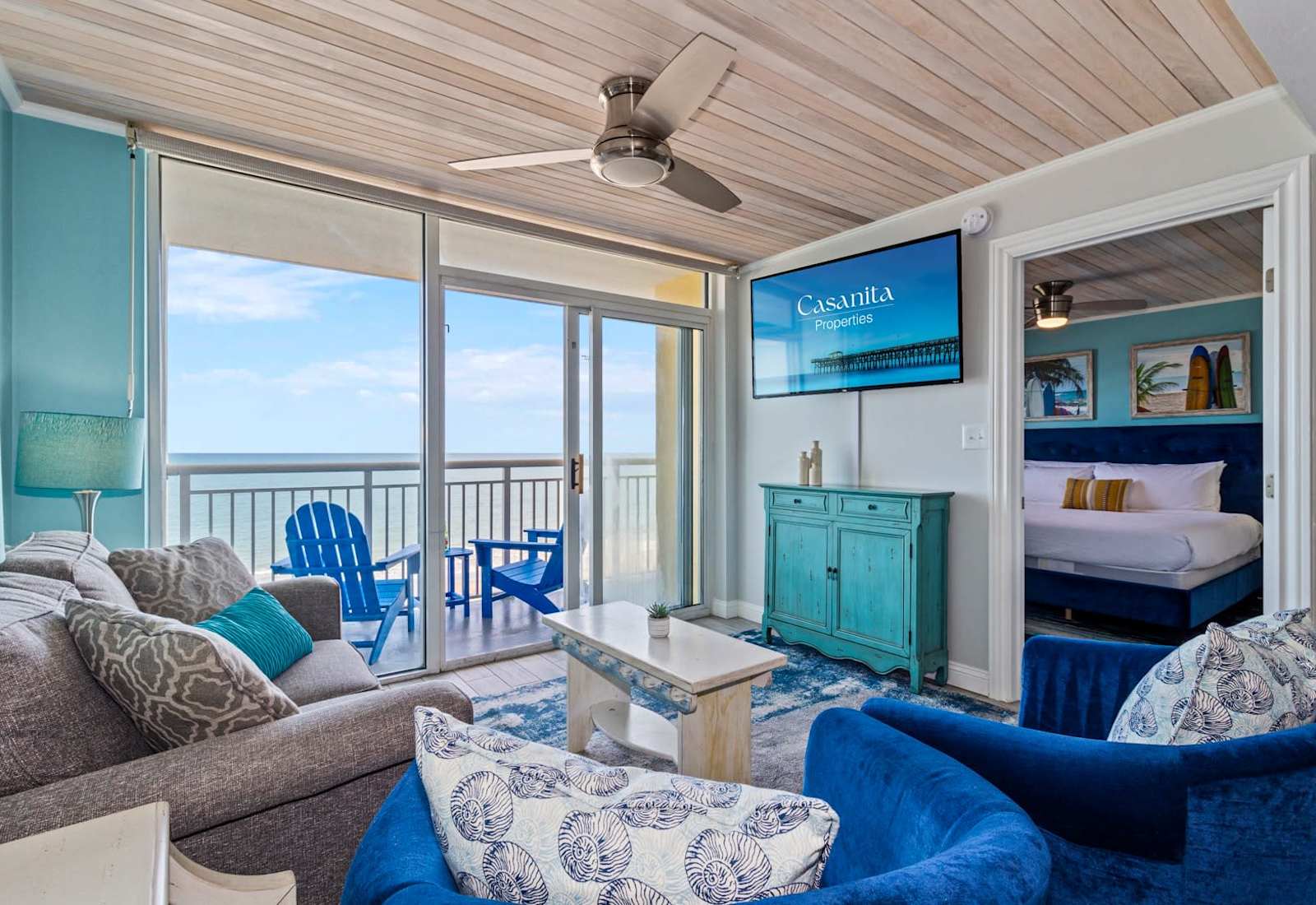 Relax in this bright and inviting living room, featuring cozy seating and a private balcony with stunning ocean views. Perfect for unwinding after a day of sun and sand, this space offers comfort and tranquility with every glance outside.