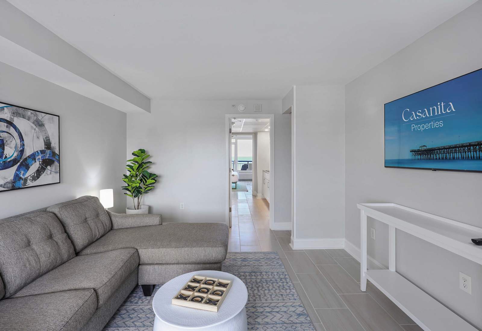 Relax in coastal comfort with this ocean-view suite featuring a plush sectional, smart TV, and a breezy open layout—just steps away from the beach. Perfect for streaming, lounging, and soaking up seaside vibes!