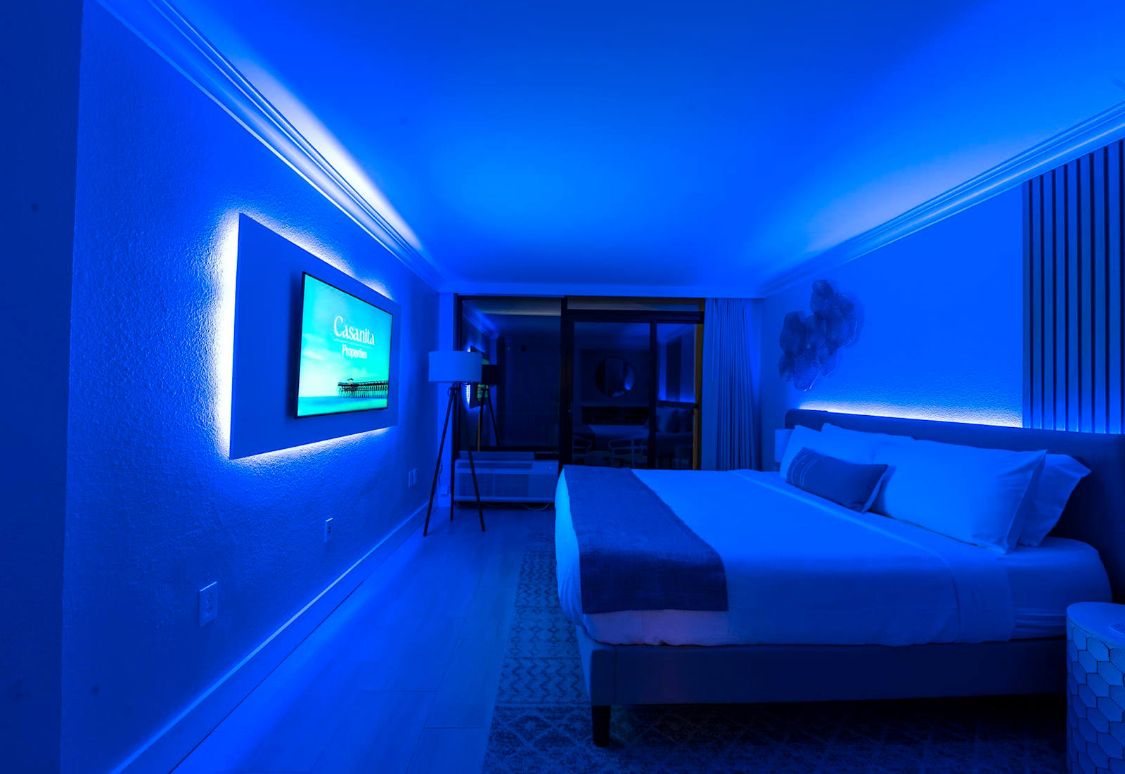 Relax in a modern and stylish room with customizable mood lighting.
