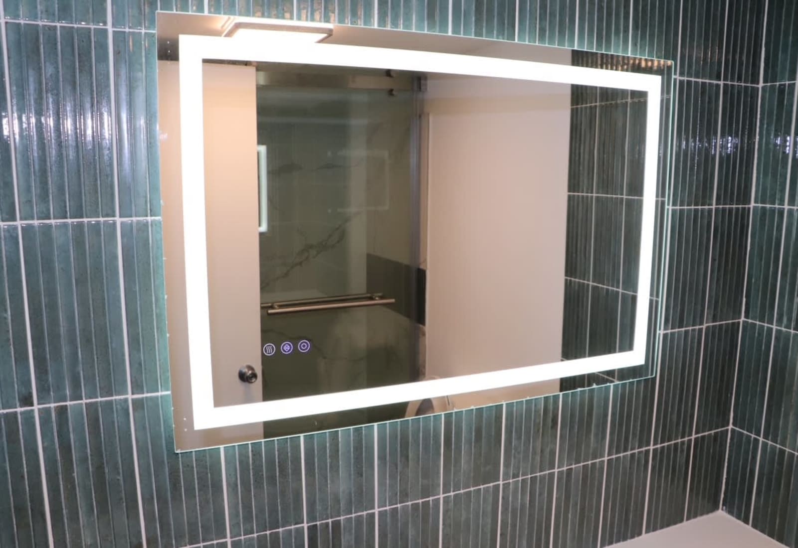 Full bathroom equipped with a Smart Vanity Mirror - it offers three different LED brightness settings, and a built in de-fogger!