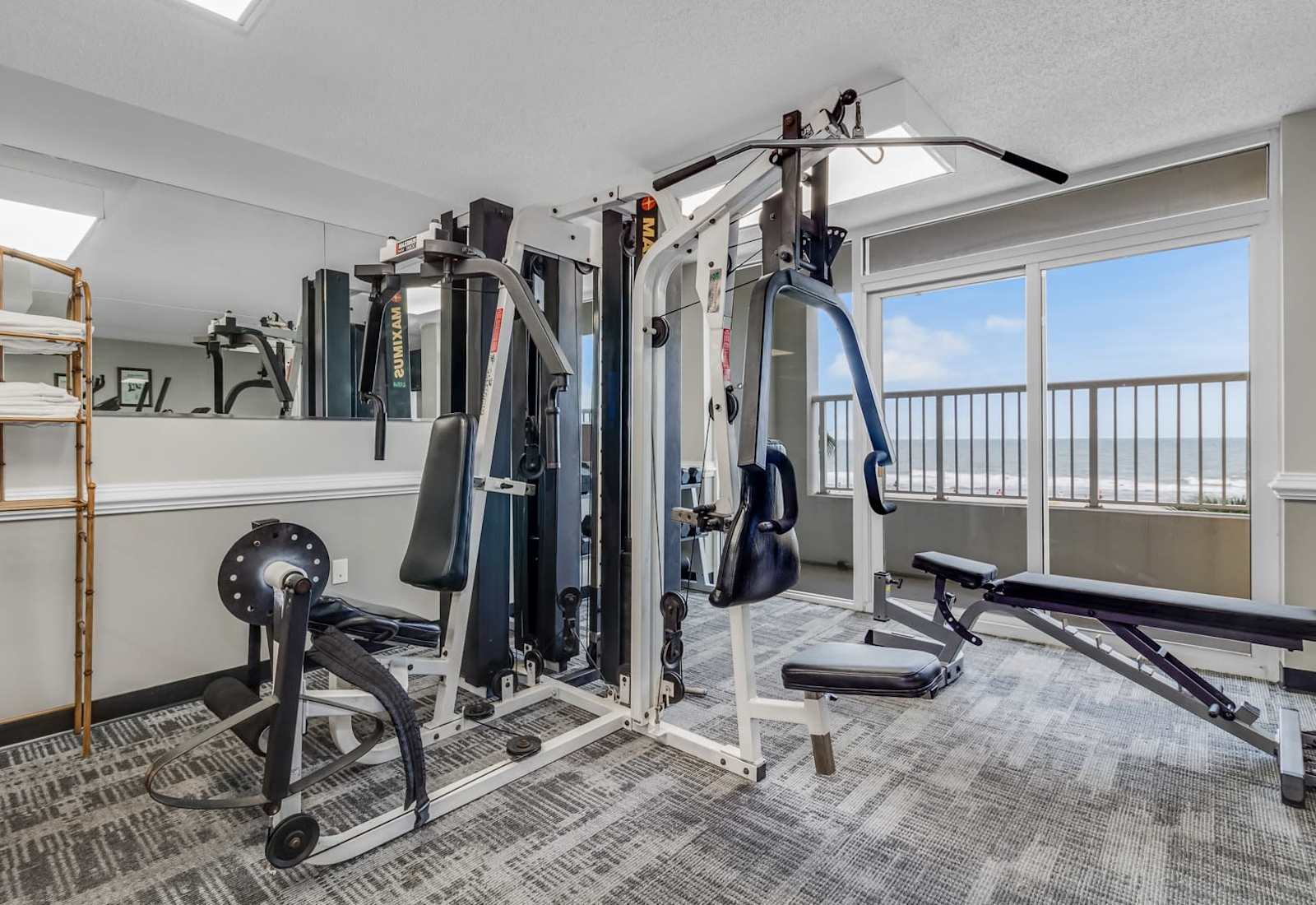 Stay active and energized in our fully equipped fitness center with a variety of strength training machines. Enjoy a workout with an ocean view to keep you motivated. Perfect for fitness enthusiasts looking to stay on track during their stay!