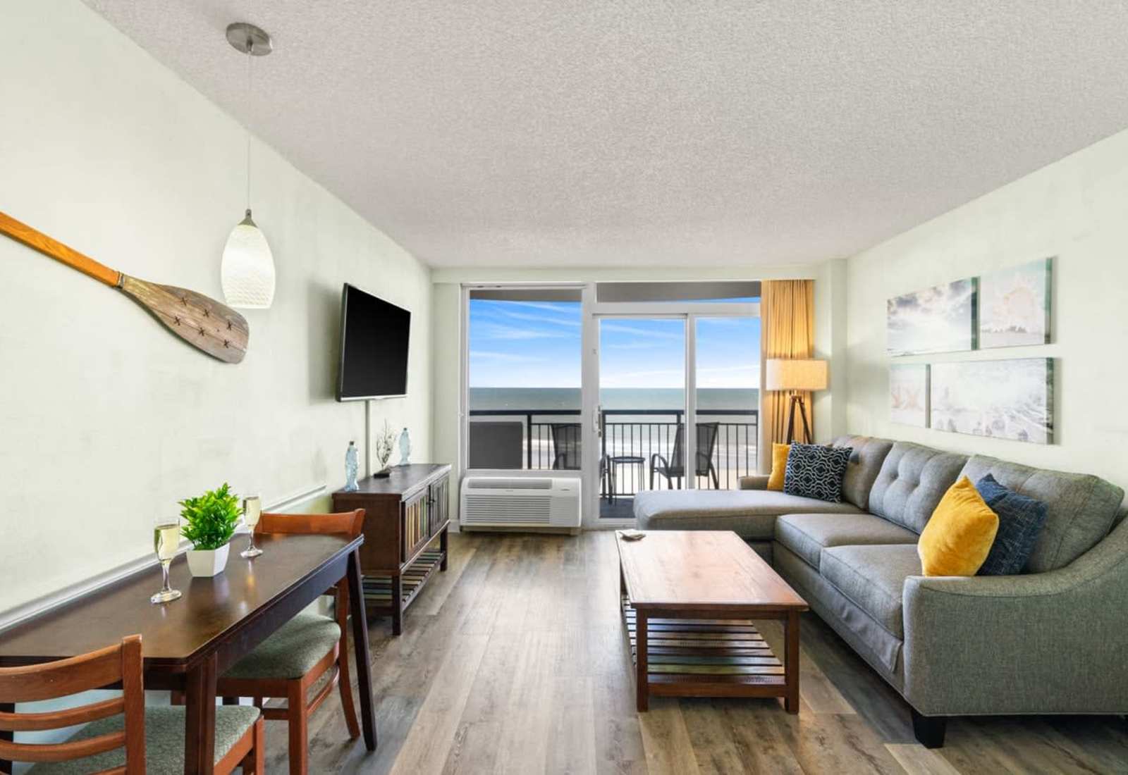 Coastal charm meets comfort in this breezy beachfront living room—sip wine, soak in the view, and unwind in style just steps from the shore. Your seaside sanctuary awaits.