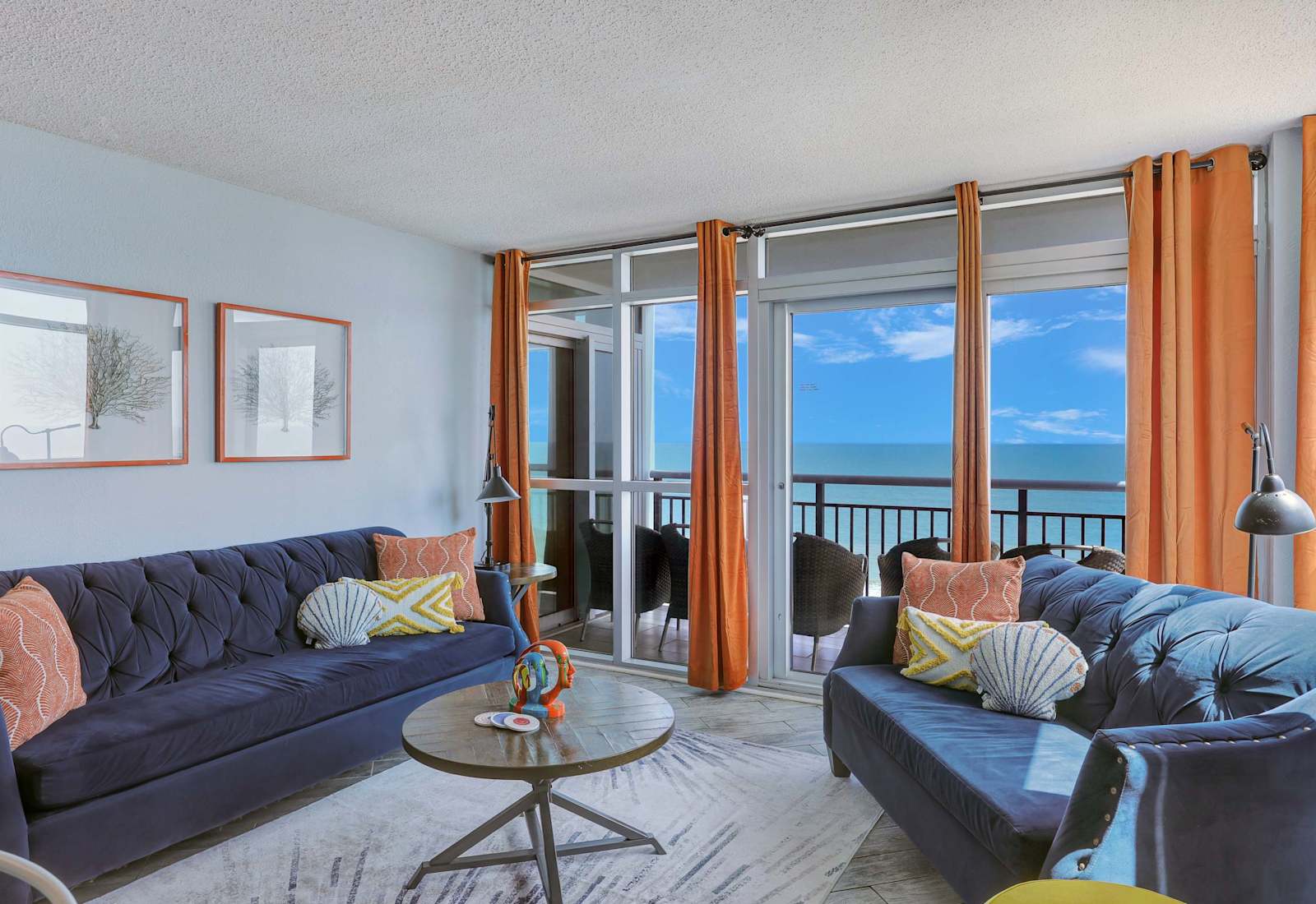 Bright, beachy, and made for memories—soak up stunning ocean views from this one-of-a-kind designer living space just steps from the sand!