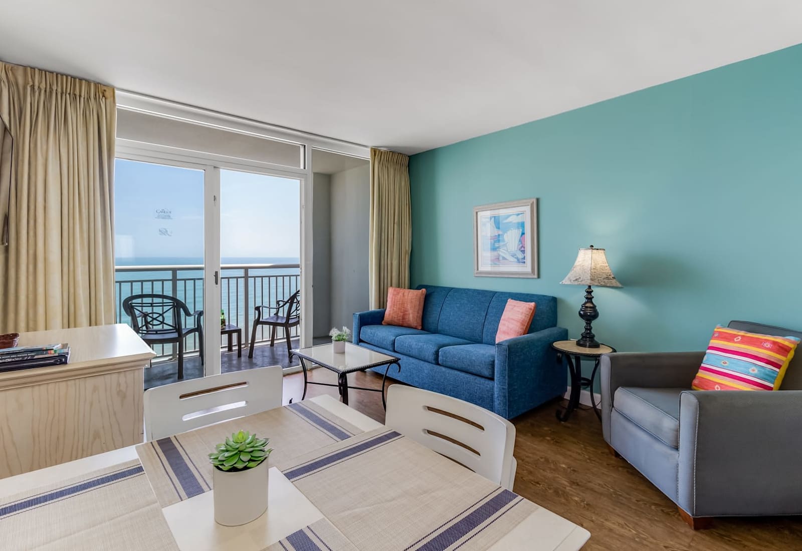 
Bright and airy living space with a pop of coastal charm! Relax on the cozy sofa or step out onto the private balcony to enjoy uninterrupted ocean views.