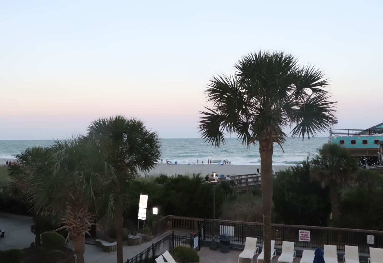 Enjoy breathtaking views of the sandy beach, ocean waves, and swaying palm trees right outside your window!