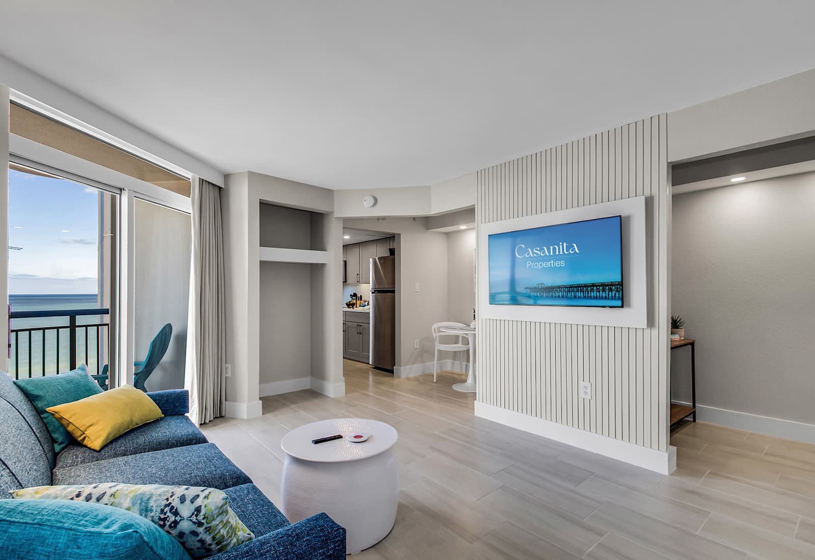 Relax in this cozy, living area featuring a plush sectional, accent lighting, and a Smart TV for entertainment. The soothing decor and comfortable seating make it an ideal spot to unwind after a day of exploring.