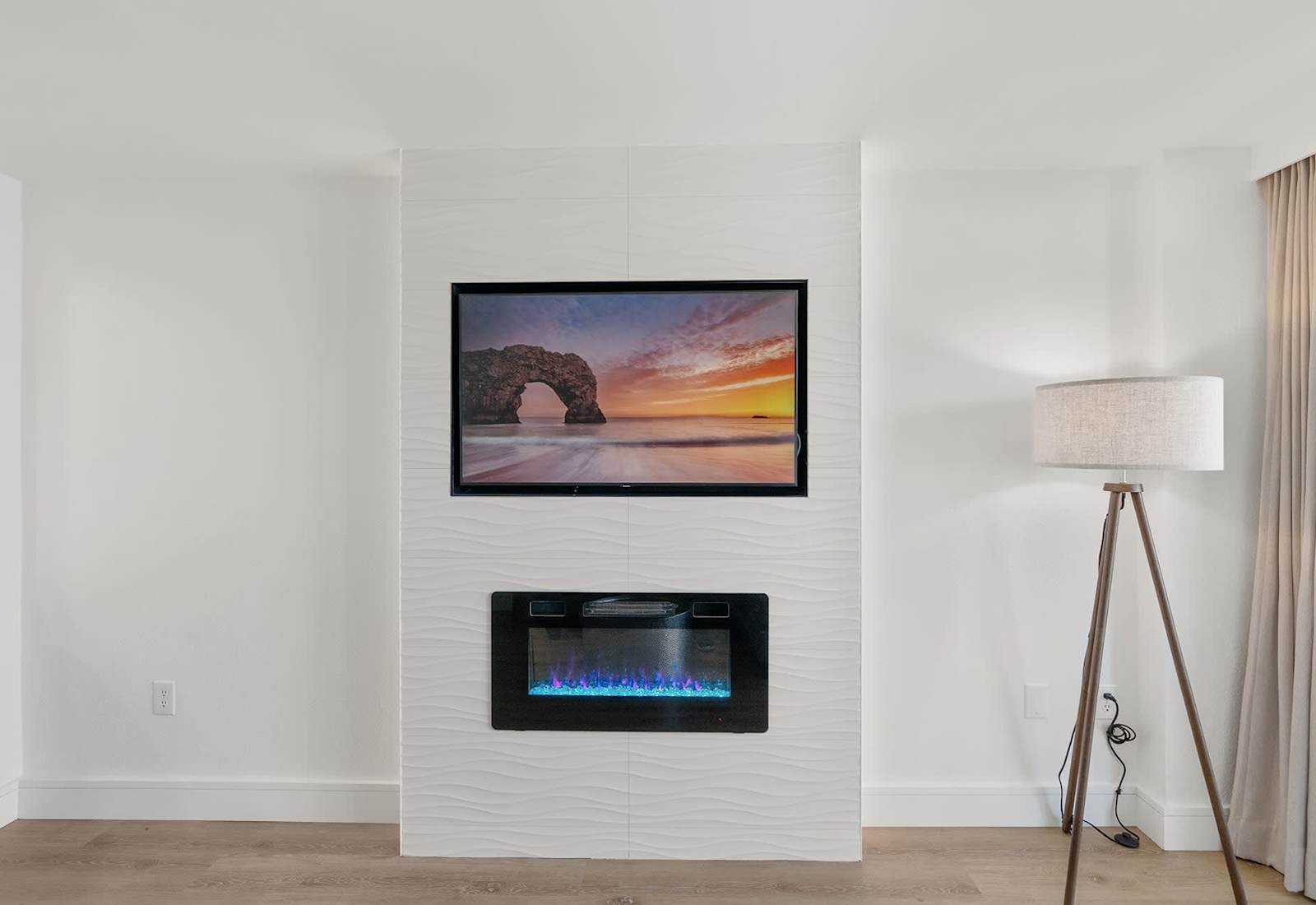 The electric fireplace adds another touch of beauty as you look out over the ocean.