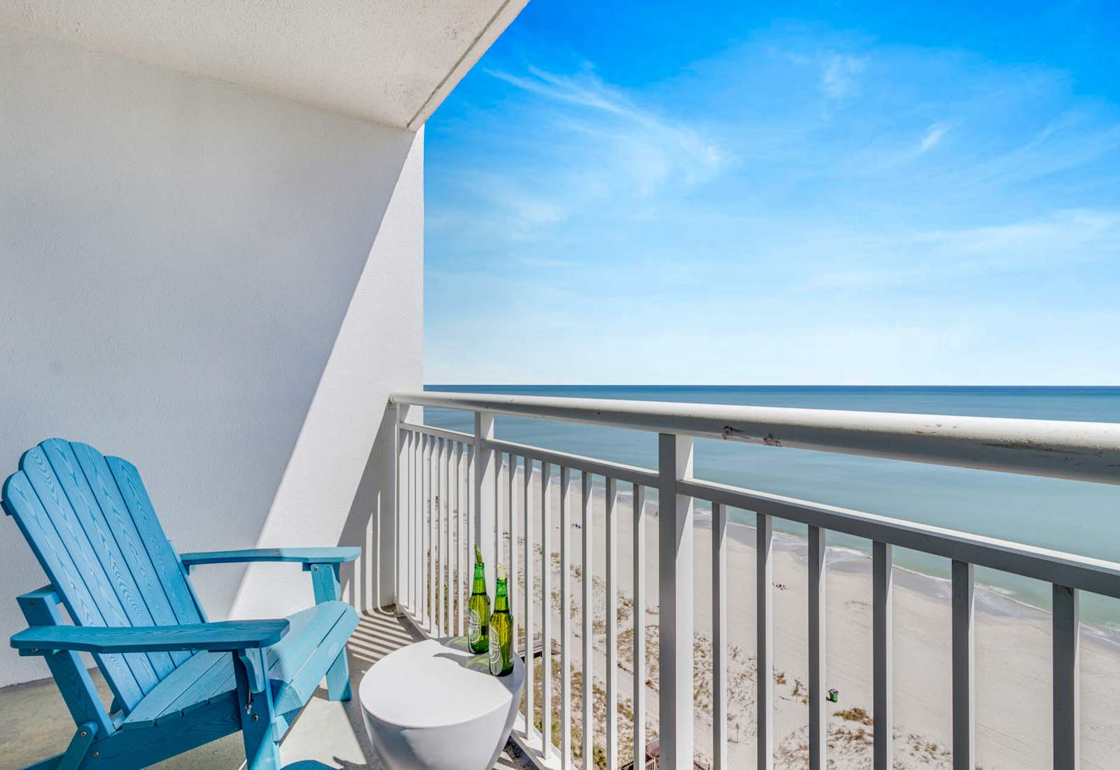 Enjoy breathtaking ocean views from your private balcony, just steps from the sandy beach.