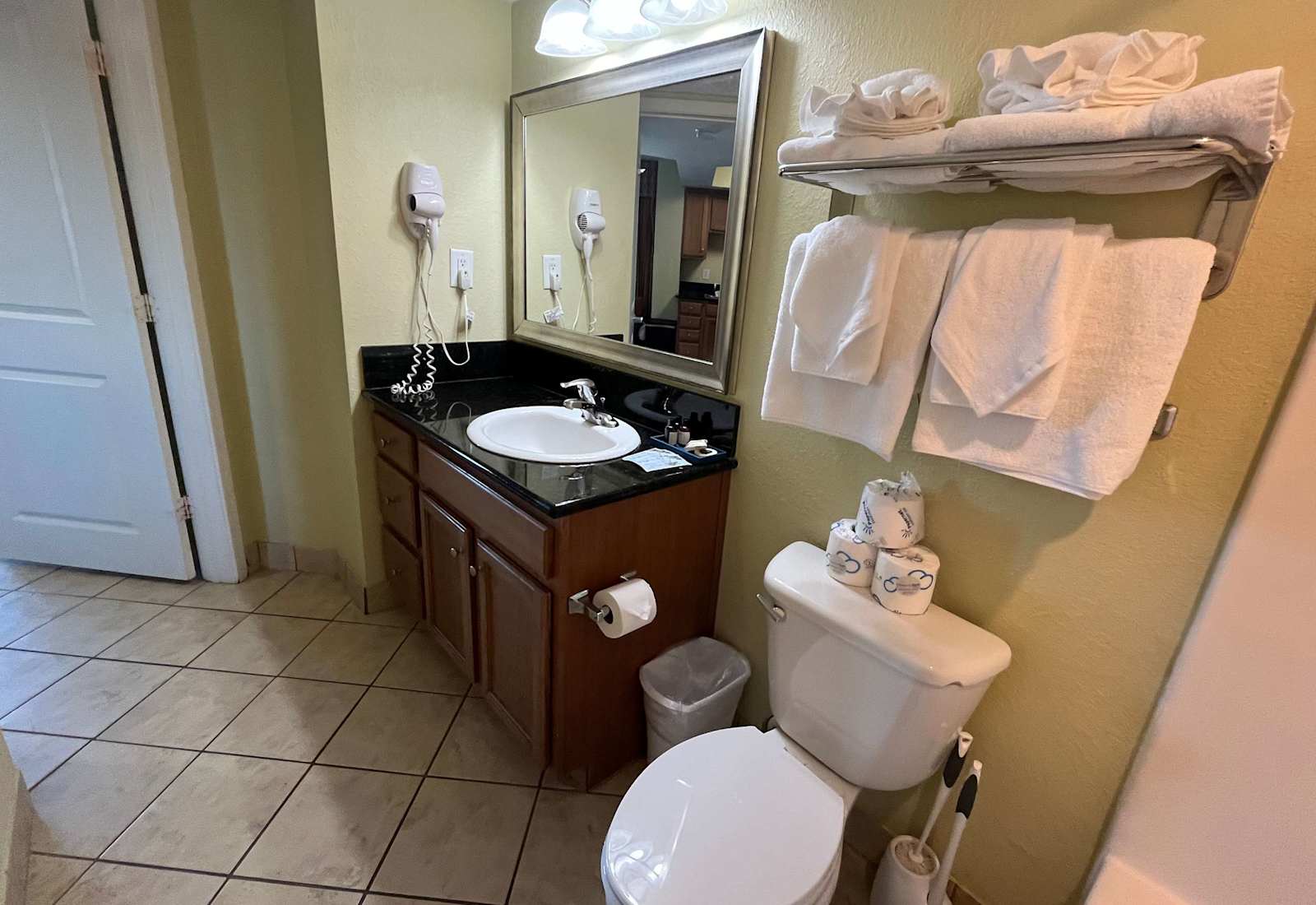 Spacious full bathroom with fresh towels, vanity sink, and all the essentials for a comfortable stay