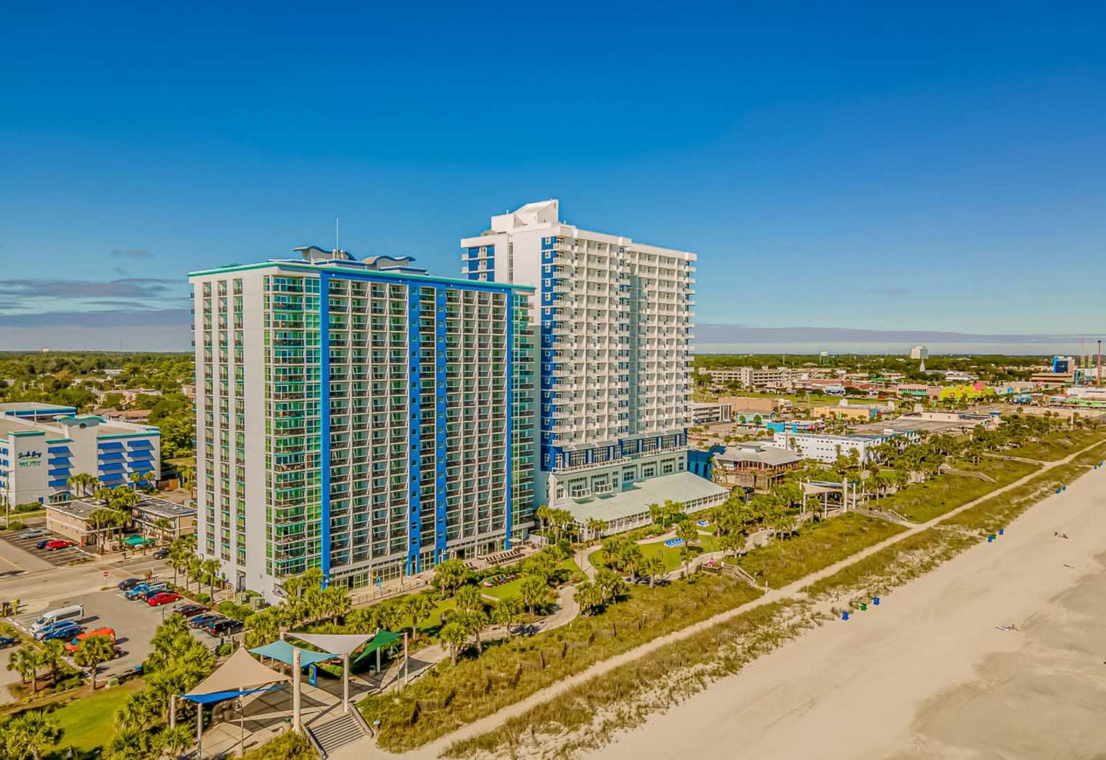 Wake up to breathtaking ocean views at this beachfront high-rise in the heart of Myrtle Beach! Steps from the sand, top-notch amenities, and walkable to dining & attractions — your ultimate coastal escape starts here! 