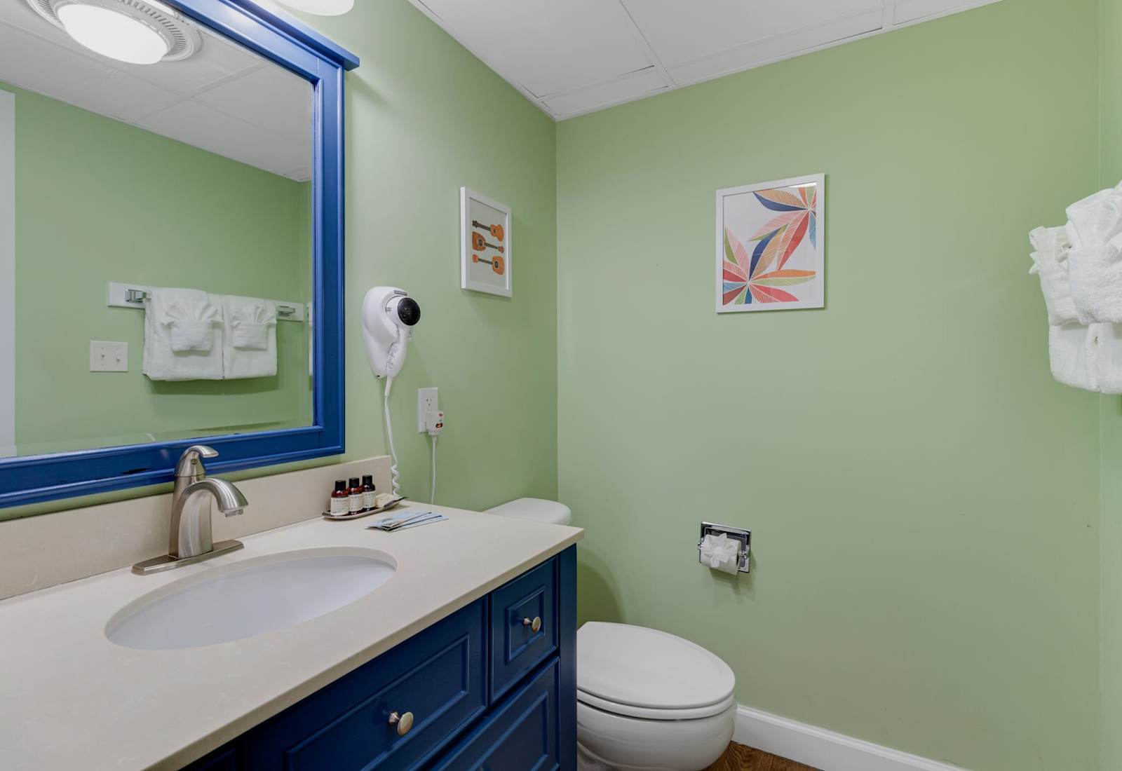 Enjoy a bright and inviting bathroom featuring modern finishes, gentle lighting, and subtle coastal touches. Conveniently situated just off the living area, it offers comfort and ease as part of your relaxing beachfront stay.