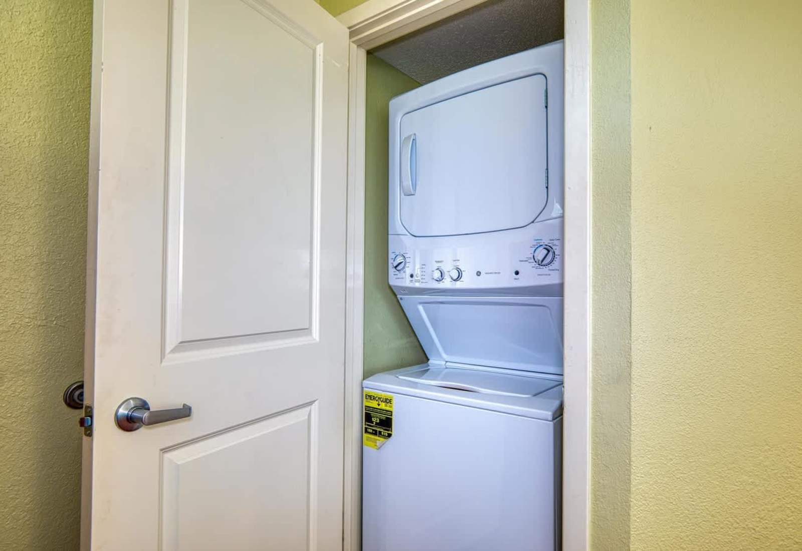 In-unit washer and dryer tucked neatly away for added convenience during your stay.