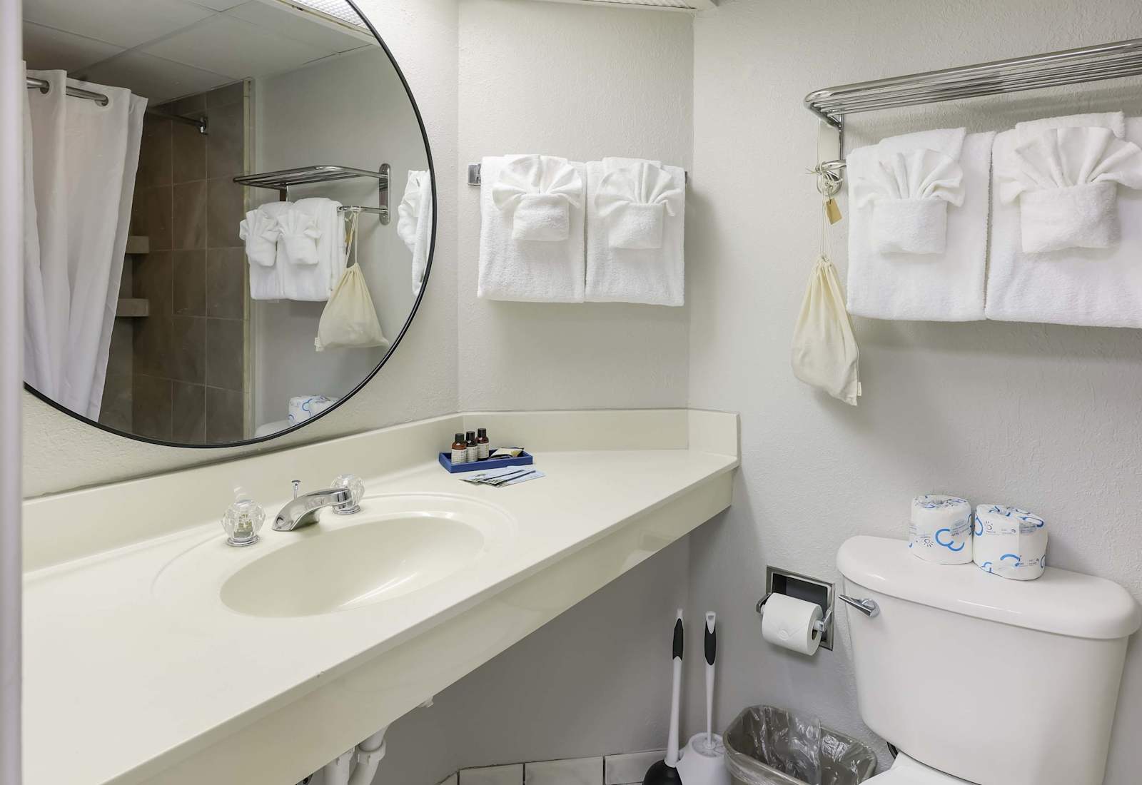 Clean, crisp, and beach-ready—this spa-inspired bathroom is stocked with fluffy towels, essentials, and a relaxing vibe that’s perfect after a day in the sun.