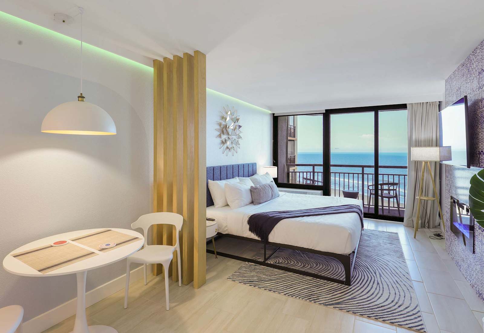 Wake up to endless ocean views in this spacious, sun-filled retreat. With a plush king bed, cozy lounge area, and private balcony, it's the perfect blend of comfort and coastal charm for a relaxing beach getaway.