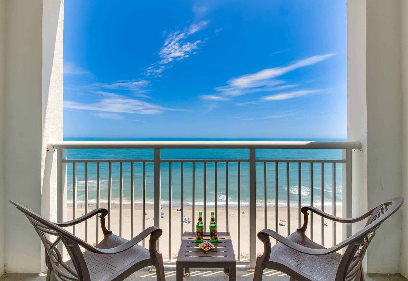Unwind on your private balcony with uninterrupted ocean views! Enjoy your morning coffee or evening drinks while soaking in the serene beach vibes and the sound of crashing waves. Your perfect seaside retreat awaits!