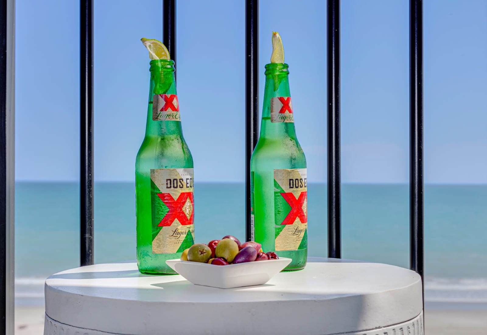 Enjoy a refreshing Peroni with a side of olives on your balcony, overlooking the waves. The perfect setting to unwind, sip, and savor the tranquil seaside ambiance, turning a simple moment into a memorable escape.