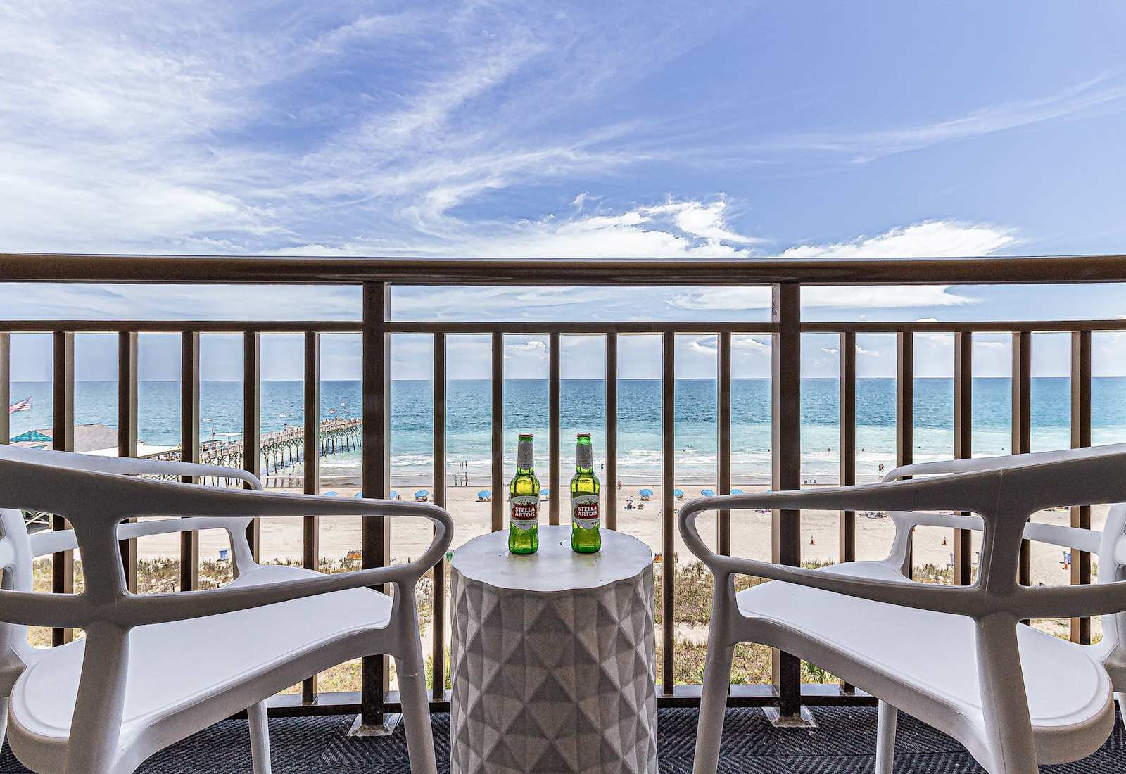 Enjoy stunning ocean views from your private balcony, complete with cozy seating to relax and take in the sights of the beach. Perfect for morning coffee or sunset evenings!