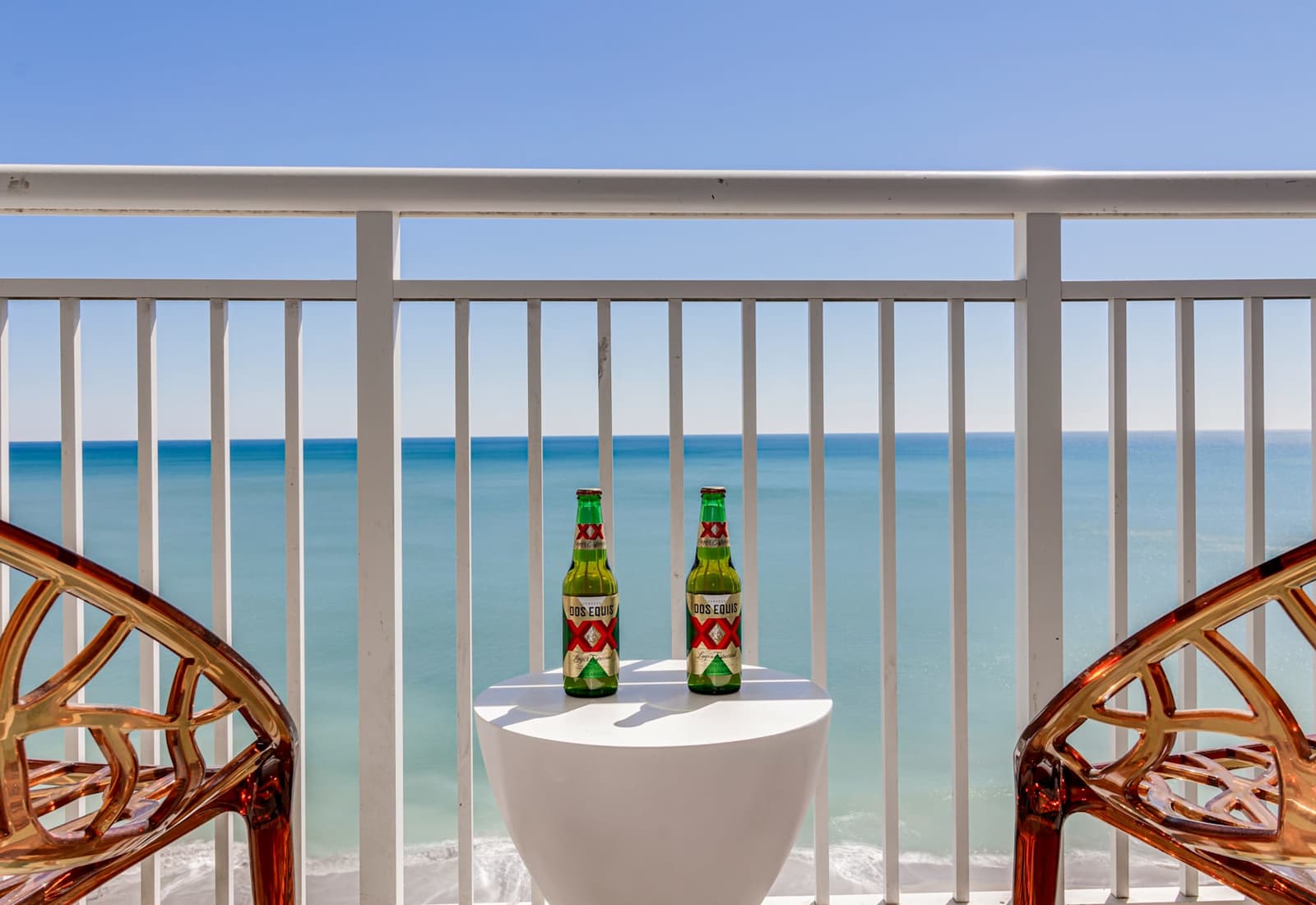 Escape to your private balcony with panoramic ocean views, perfect for unwinding with a drink in hand. Feel the sea breeze, soak in the sights of the beach below, and create unforgettable moments in this serene retreat.