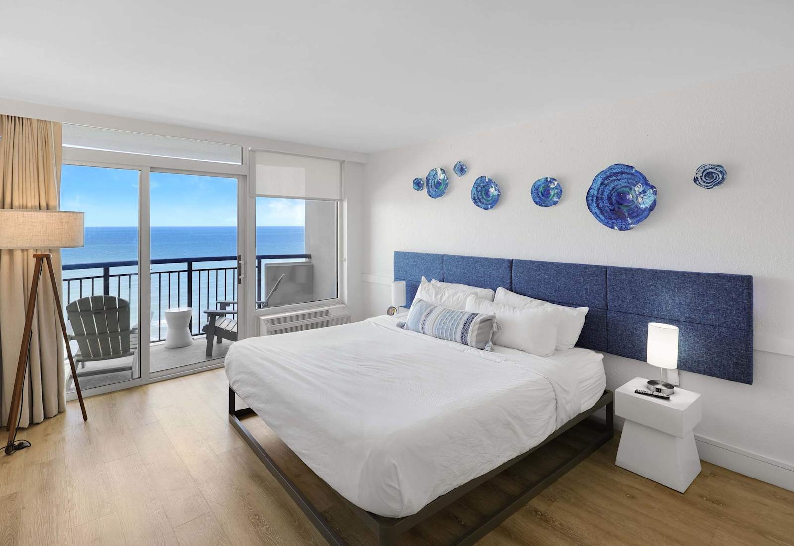 Enjoy a great night's sleep in this bedroom, featuring a plush king-size bed, modern decor, and plenty of natural light.