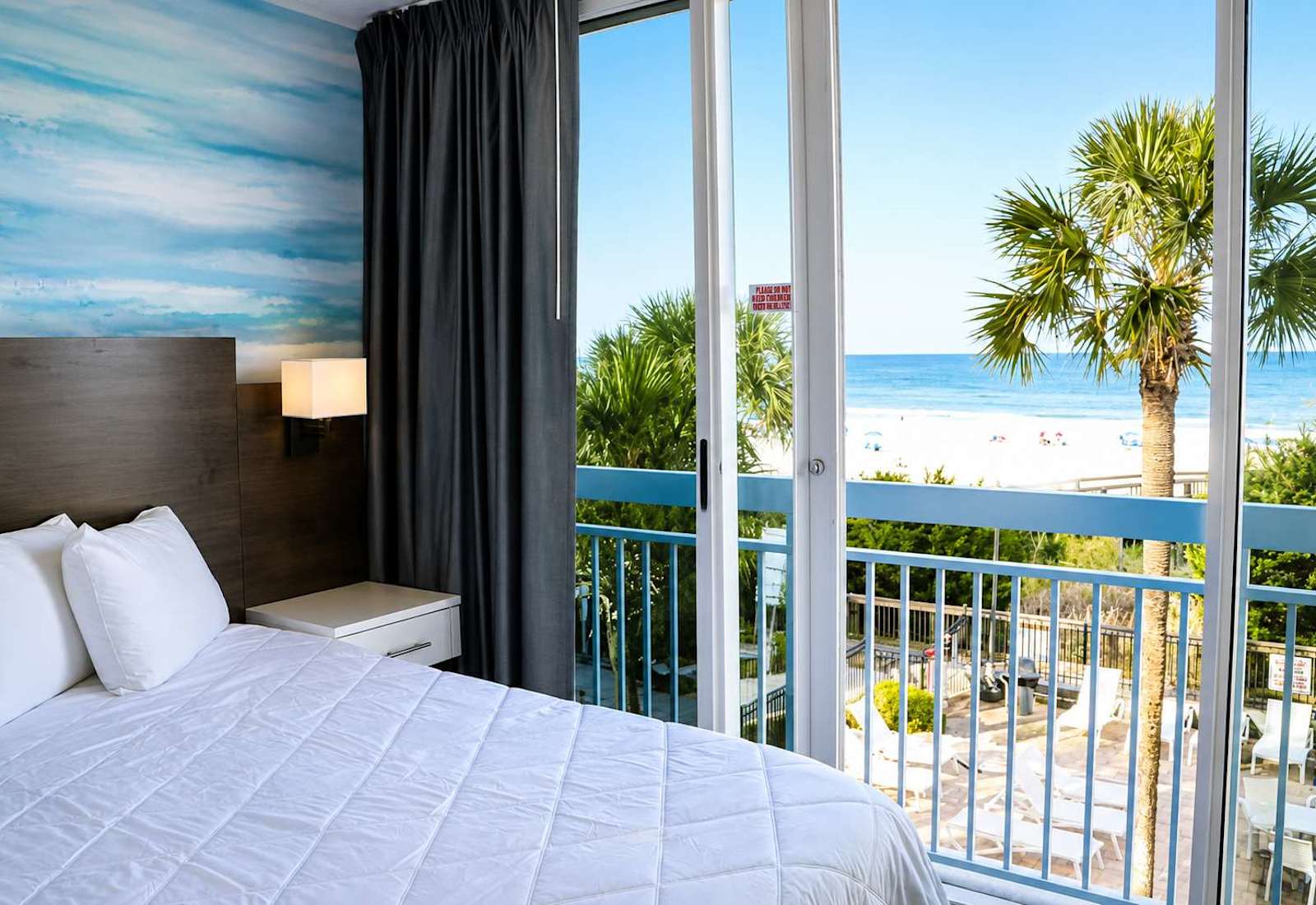 The master bedroom also features it's own Juliet balcony, with scenic oceanfront views.