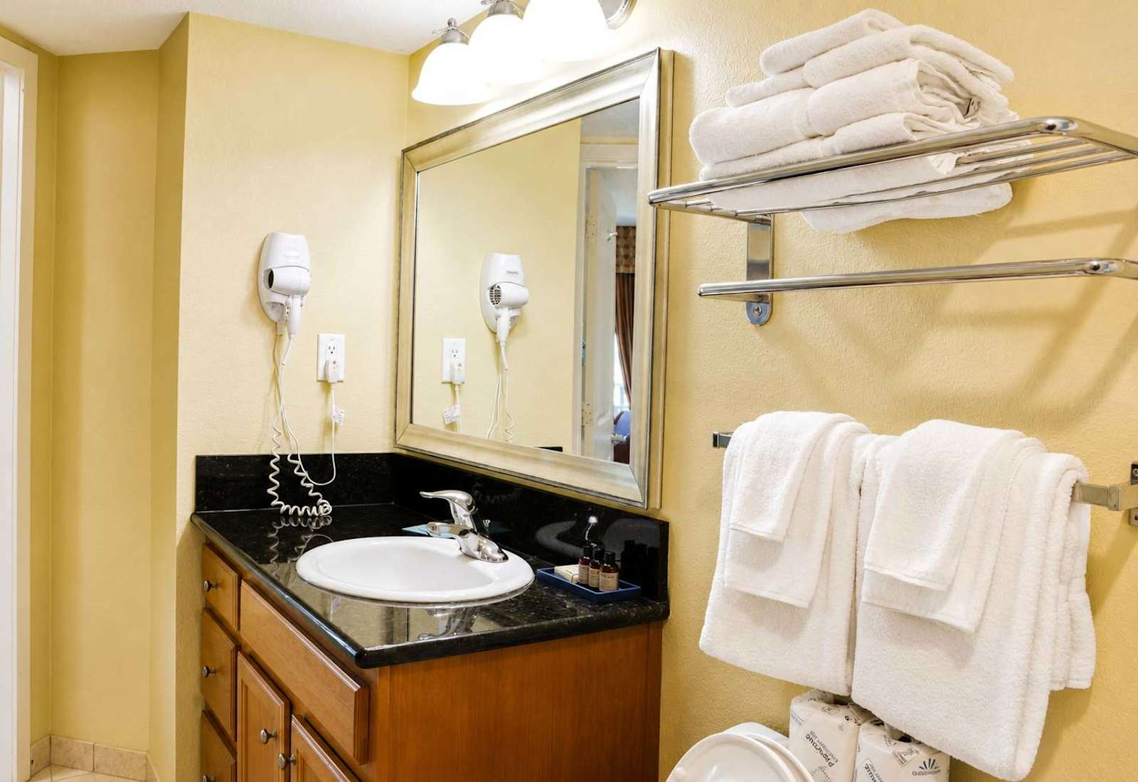 Refresh and unwind in a thoughtfully appointed bathroom featuring upscale amenities, premium toiletries, and plush 14lb towels designed to bring resort-quality comfort to every stay.