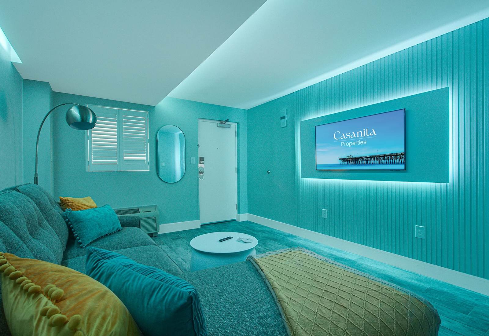Enhanced by ambient purple lighting that sets a relaxing mood. The cozy sectional, modern decor, and wall-mounted TV create an inviting atmosphere, perfect for evening relaxation or movie nights in style.