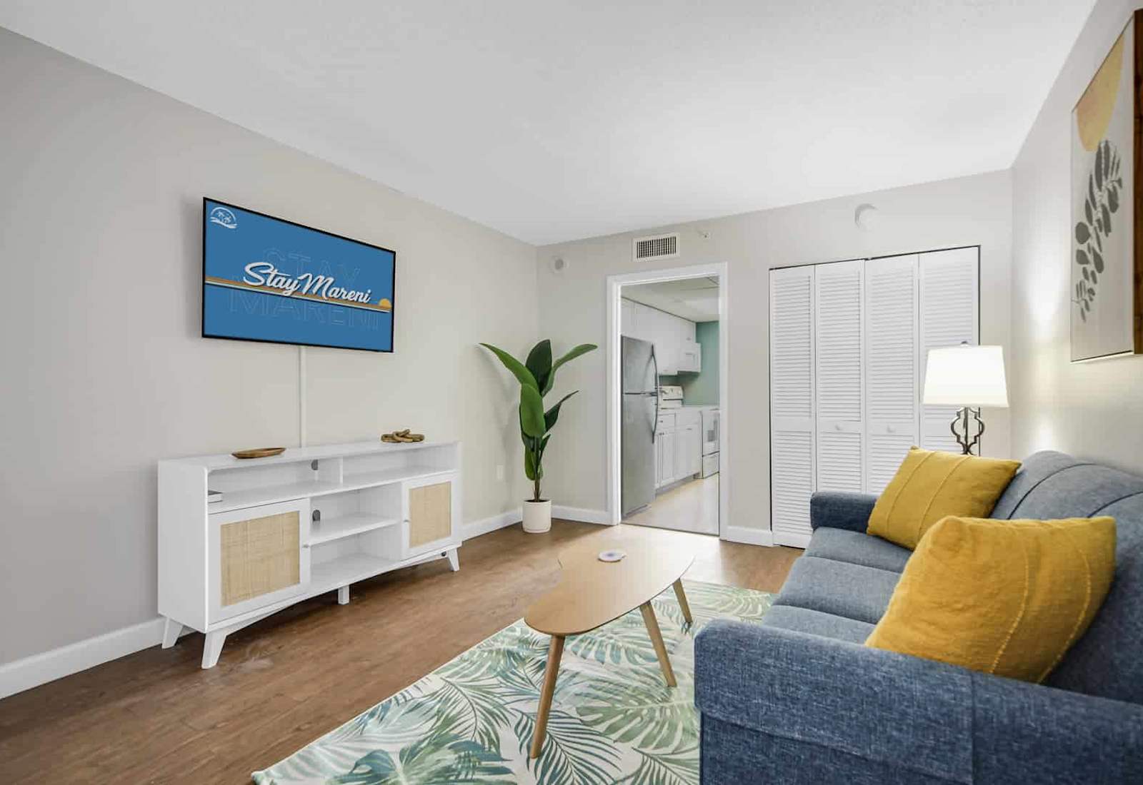 Unwind in this chic and cozy living room, featuring stylish décor, a plush sofa, and a smart TV for your entertainment. The perfect spot to relax after a day of beachside adventures.