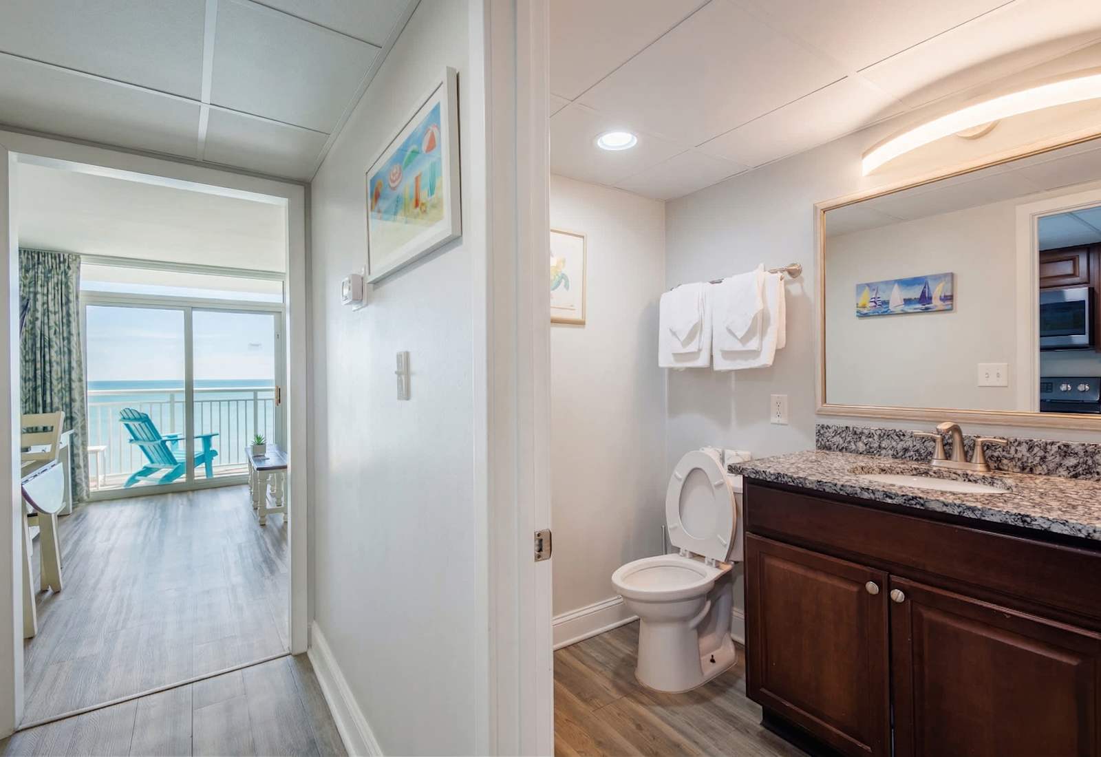 Enjoy convenience and comfort with this thoughtfully designed layout! A sparkling clean bathroom and cozy living area flow seamlessly into a private balcony with breathtaking ocean views—your perfect beach retreat awaits!