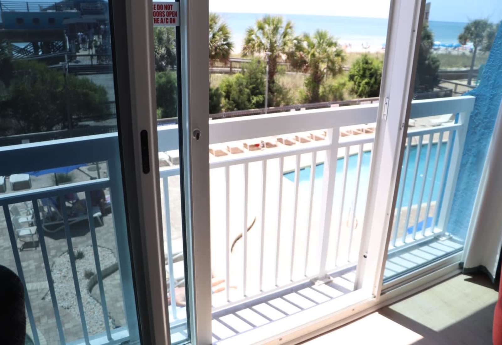Enjoy beautiful ocean and palm tree views straight from your Juliet balcony!