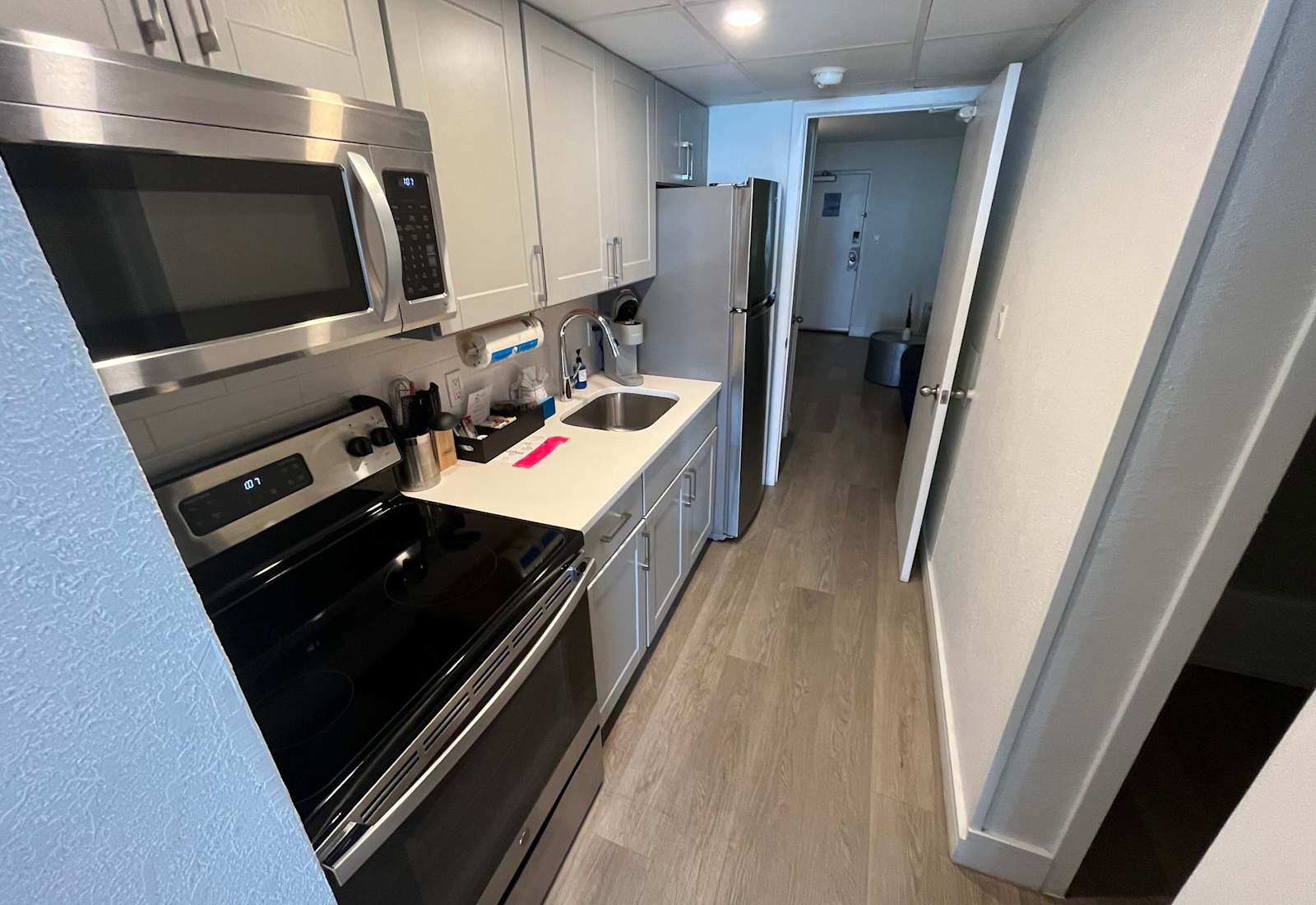 Enjoy the convenience of a fully equipped modern kitchen, complete with stainless steel appliances, sleek cabinetry, and all the essentials to prepare your favorite meals during your stay.