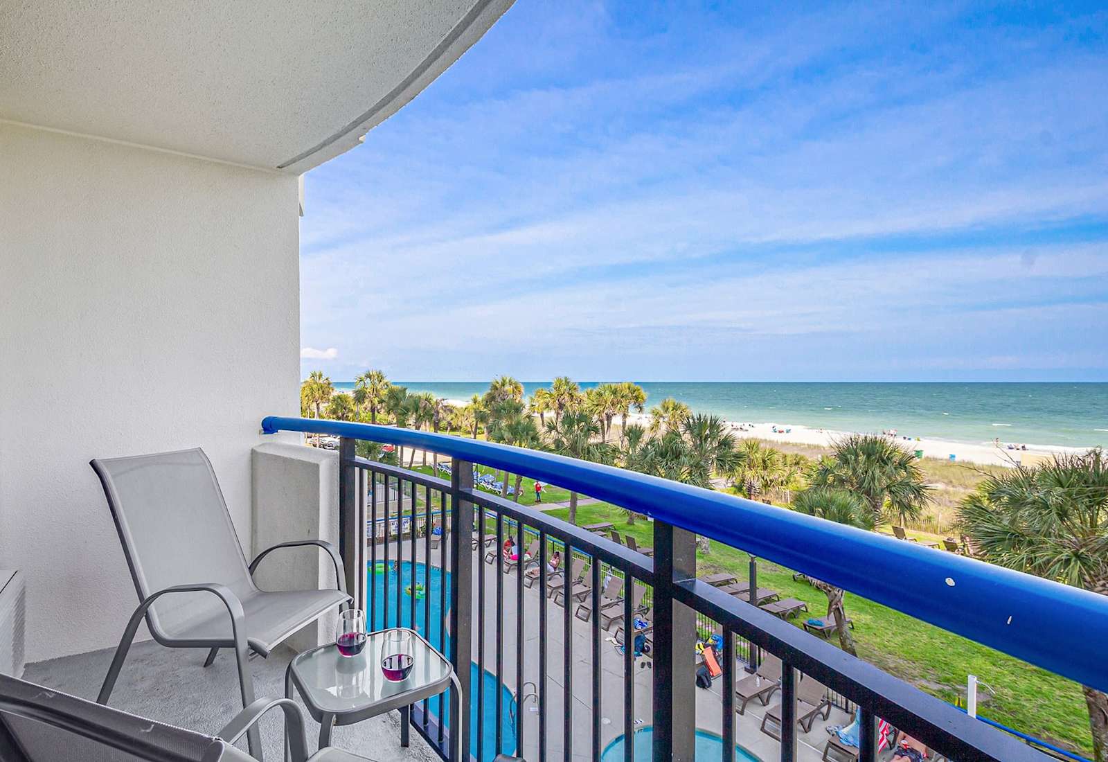 Step out onto your private balcony and soak in panoramic ocean views. With comfortable seating and a side table perfect for snacks or drinks, this serene spot invites you to unwind and enjoy the gentle sea breeze and the calming sound of the waves.
