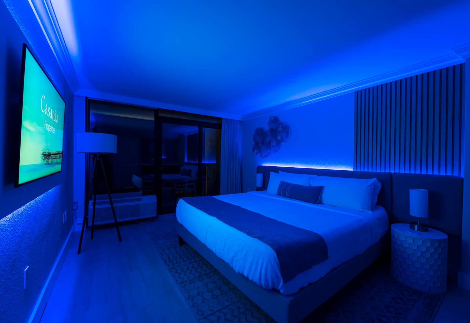Relax in a modern and stylish room with customizable mood lighting.
