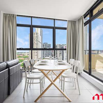 Dining space with balcony access and natural light.