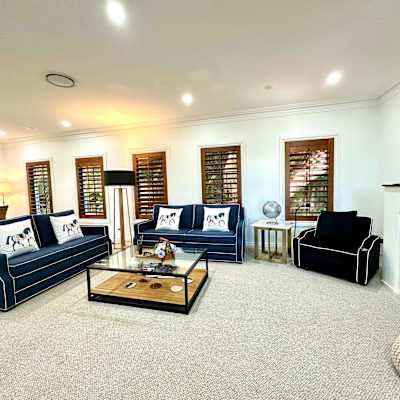 Additional living space with fireplace, lounge seating, and open-plan layout.