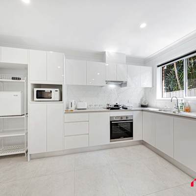 Modern kitchen with quality appliances and ample counter space for easy meal preparation.