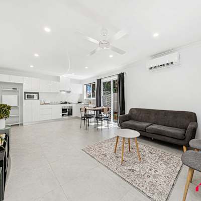Bright and airy living space with comfortable seating and an open-plan layout — perfect for relaxing and entertaining.